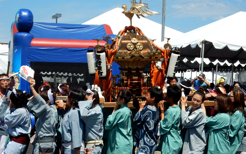 people carrying mikoshi or portable shrine during 2017 charity festival