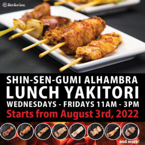 Yakitori skewers on the white dish, and some yakitori images on the red charcoal pictures